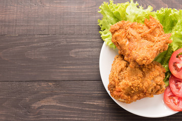 Fried chicken breast on a wooden background
