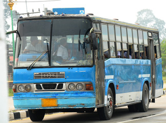 retro school bus driving along stre