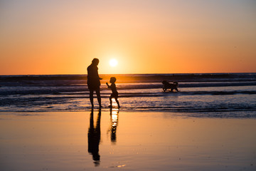Silhouette of Mother and Child at Sunset