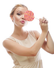 fashion blond woman  holding lollipop