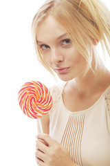 fashion blond woman  holding lollipop