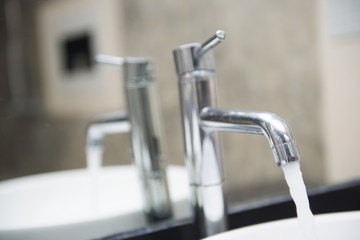 Open water from the faucet in the basin