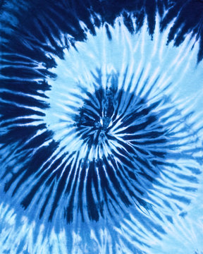Fototapeta close up shot of spiral blue tone color tie dye fabric texture background