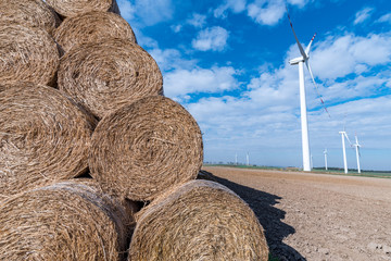 Hay bales and windmills
