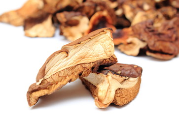 Heap of dried mushrooms on white background