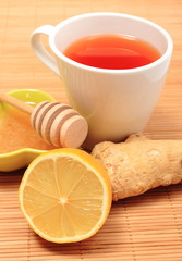 Cup of healthy tea with honey ginger and lemon