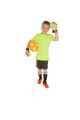 Young boy soccer goalie holding ball waving hand