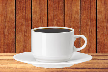 white cup of coffee on wooden table over wooden planks