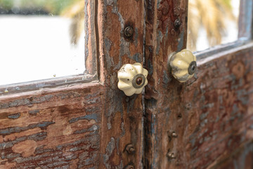 Classic door handle on wooden door