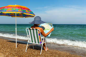 girl on the beach, sunbathing, girl with a laptop, woman under a