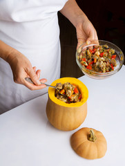 Cooking pumpkin stuffed with meat and vegetables