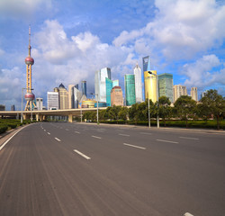 Obraz na płótnie Canvas Empty road with Shanghai Lujiazui city buildings