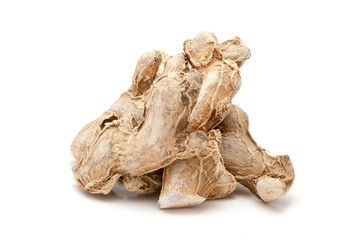 Pile of Organic Dried Ginger root or Sonth (Zingiber officinale) isolated on white background.