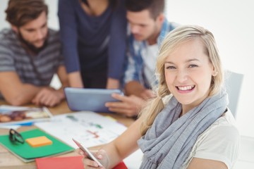 Portrait of cheerful woman using smartphone 