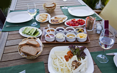 Rich and delicious Turkish breakfast on wood table