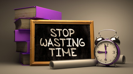 Stop Wasting Time - Motivational Quote on Chalkboard.
