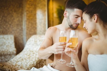 Romantic couple together with champagne glasses