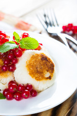 Cottage cheese pancakes with fresh currants, healthy breakfast