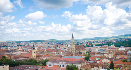 Fototapeta na wymiar Cluj Napoca cityscape from above in the Transylvania region of Romania with the historic medieval old center, the gothic cathedral, the franciscan church and the Technical University
