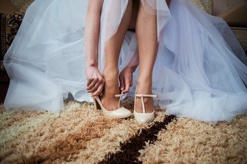 The bride getting her wedding shoes on