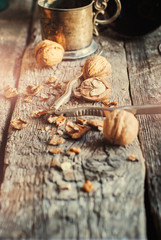 Walnuts on the Wooden table. One with a Heart inside