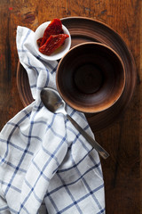 Set of traditional rustic vintage plates of clay on vintage wood