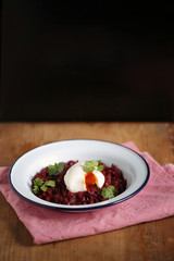 Beetroot barley gluten-free risotto with a poached egg on top