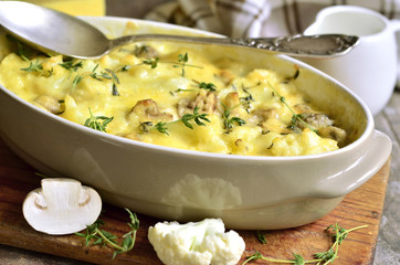 Baked cauliflower with mushrooms.