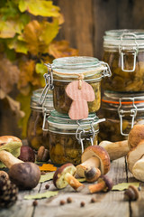 Preparation kitchen mushrooms marinated jars wooden table