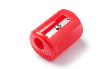 Red pencil sharpener on white background