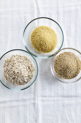 Cereals in bowls : Oats, Couscous, Quinoa