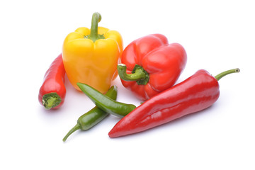 Colored peppers on white background