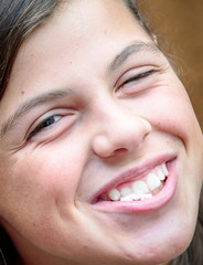 pretty girl smiling with his mouth full