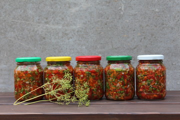 Set of canned vegetables and fennel inflorescence.

