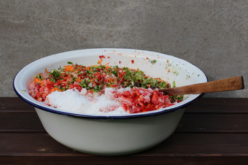 A bowl with cut vegetables.

