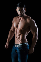 Fototapeta na wymiar Portrait of a fitness man with muscular body