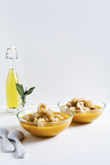 Pumpkin soup on a white table