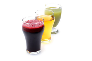 Fresh fruit and vegetable juices on white background