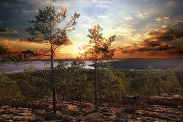 Fototapeta premium fantastic summer sunset - landscape in the north of the mountain forest lake