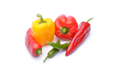 Colored peppers on white background