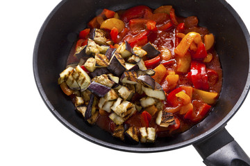 roasted red and yellow sweet peppers and eggplant on pan