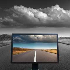 Colour concept with TV screen on open road