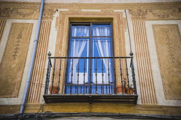 Traditional architecture with balconies and old windows, city of