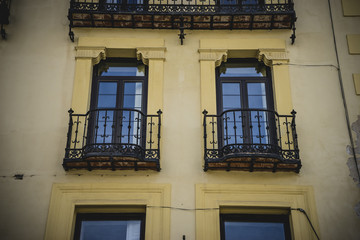 Obraz premium Traditional architecture with balconies and old windows, city of