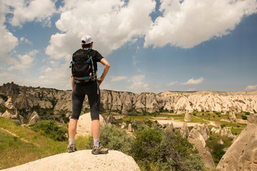 Lonely traveler looking to Cappadocia rocks