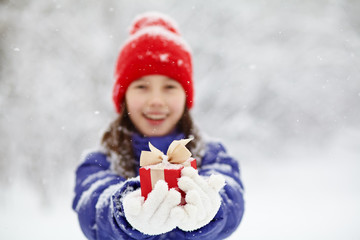 teenage girl with a gift in their hands