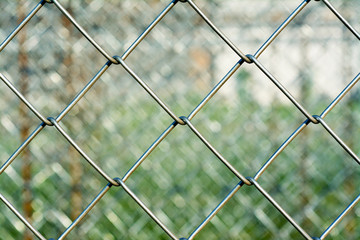 Metal mesh with blurred background,