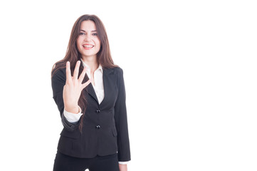 Fototapeta premium Young business female showing number four with fingers
