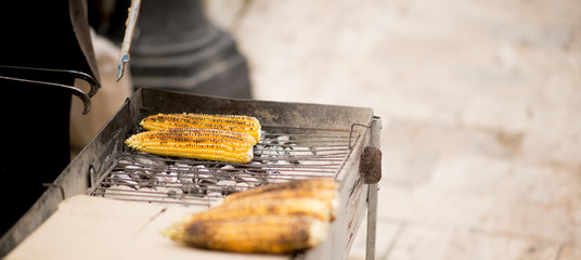 Street vendor sells  grilled corn © bellakadife