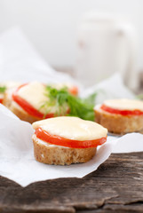  Little Snacks with Bread, Tomato, Cheese Baked in an Oven